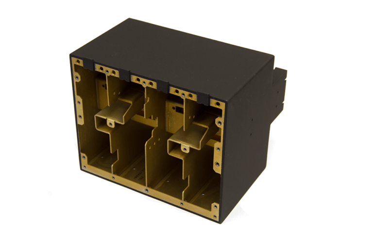 Multi-compartment precision-machined chassis with black anodized exterior and gold chromate internal finish, featuring integrated mounting structures and partitioned electronic component sections with reinforced structural supports.