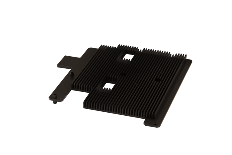 Precision-machined aluminum heat sink with parallel cooling fin architecture, featuring anodized black finish, strategic cutouts for component integration, and mounting interfaces designed for high-performance defense electronics cooling applications.