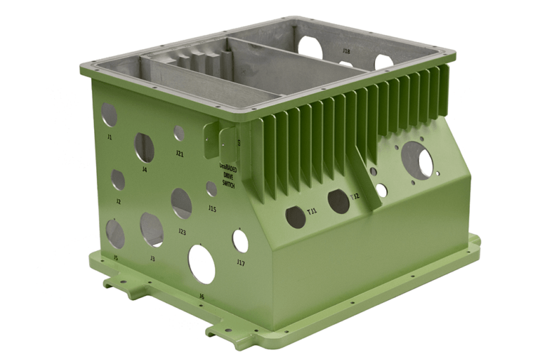 Precision-manufactured green aluminum electronics enclosure with integrated heat sink fins, featuring multiple circular apertures and machined compartments for defense systems applications.