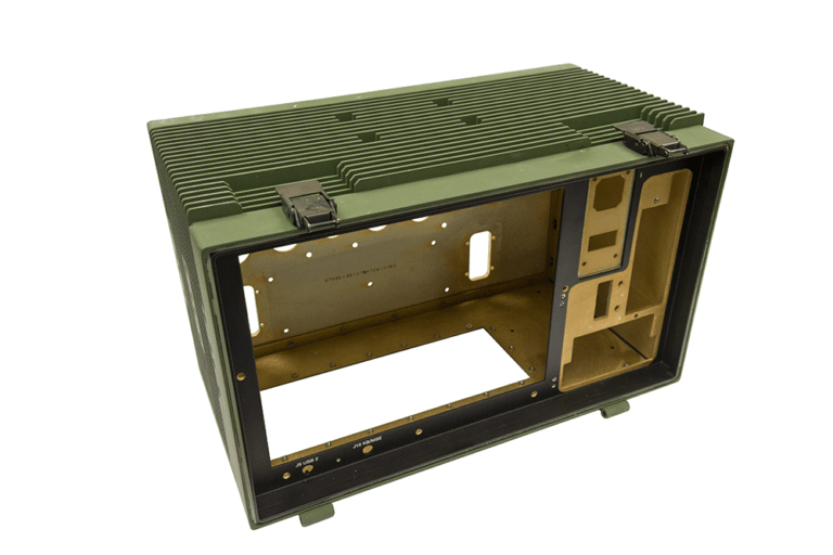 Internal view of ruggedized mil-spec enclosure with integrated cooling fin architecture, gold-chromate interior surfaces, and precision mounting interfaces designed for tactical field deployment of communications equipment.