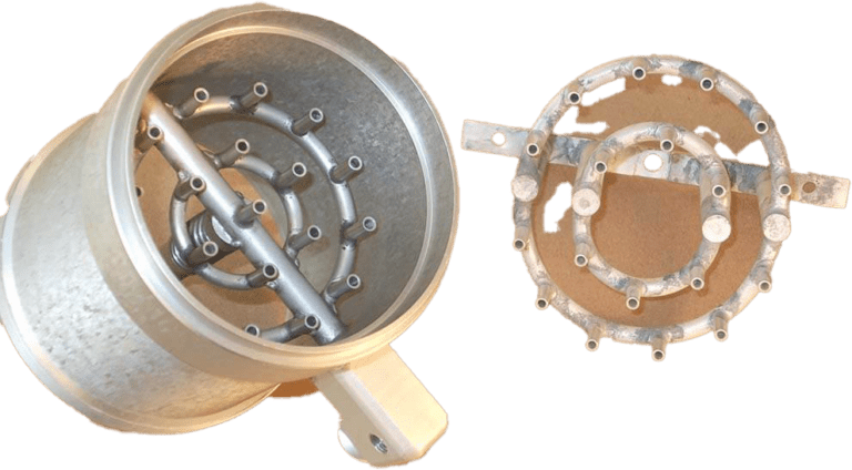 Custom dip-brazed aluminum fluid distribution manifold assembly with concentric flow paths and corresponding ring mount, featuring precision-drilled ports and specialized mounting interfaces for aerospace cooling systems.