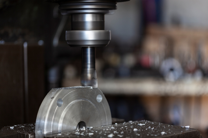 Mechanic working with lathe machine